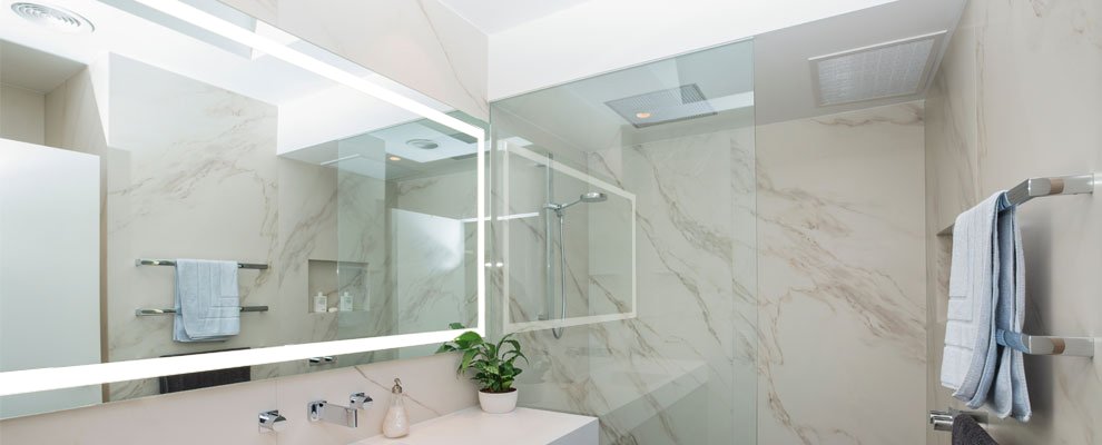 A Bathroom in Australia containing one of Clearlight Designs Australian Made Lighted Mirrors